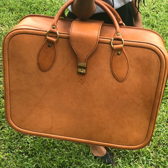 tan leather suitcase